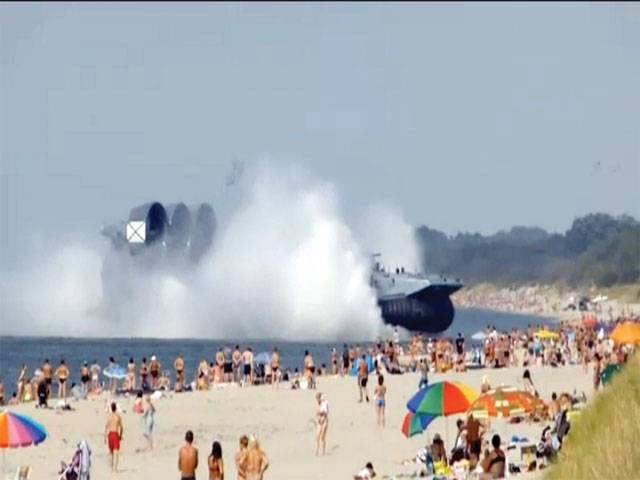 Navy hovercraft stuns sun-seekers