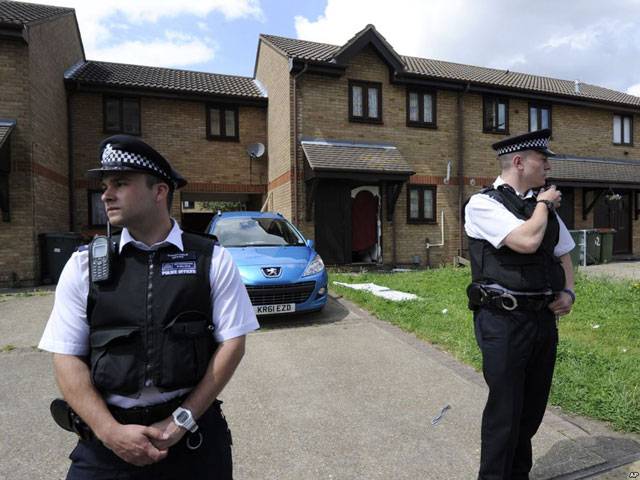 British police hold four terror suspects in raids 