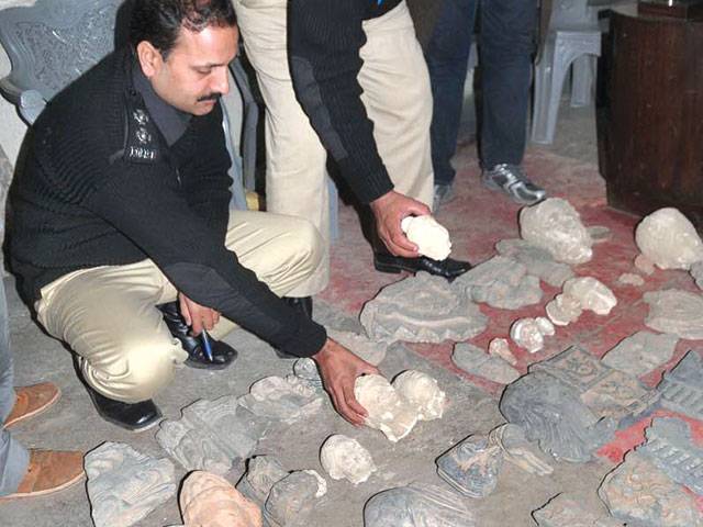 Two arrested with 50 pieces of statues