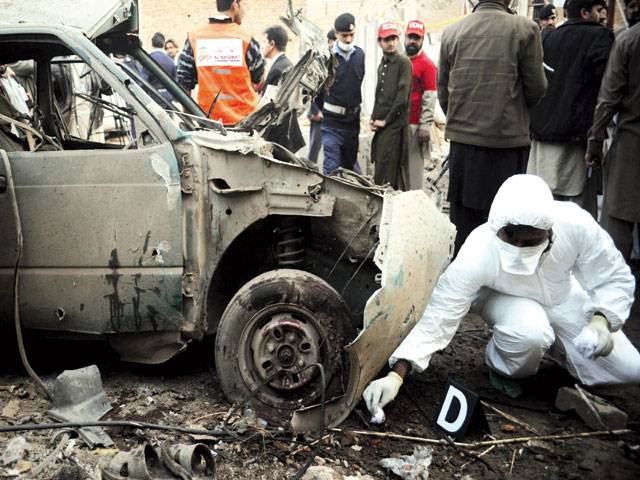 Car bomb hits repair shop; 6 dead 