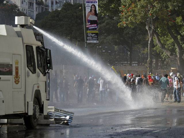 Venezuela marks year without Chavez amid protests
