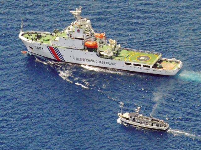 Philippine vessel evades Chinese ships in disputed waters