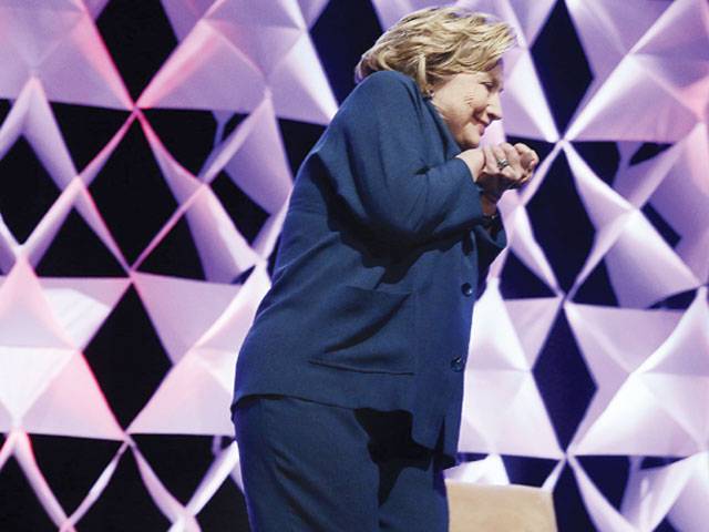 Woman throws shoe at Hillary