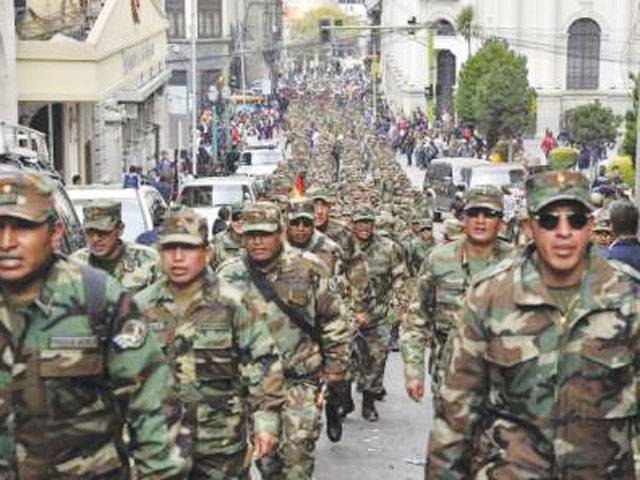 Bolivia sacks hundreds of army men after protest
