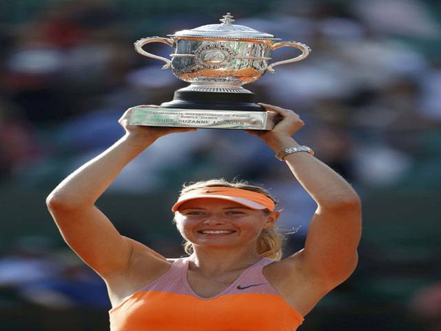 Maria Sharapova of Russia holds the trophy