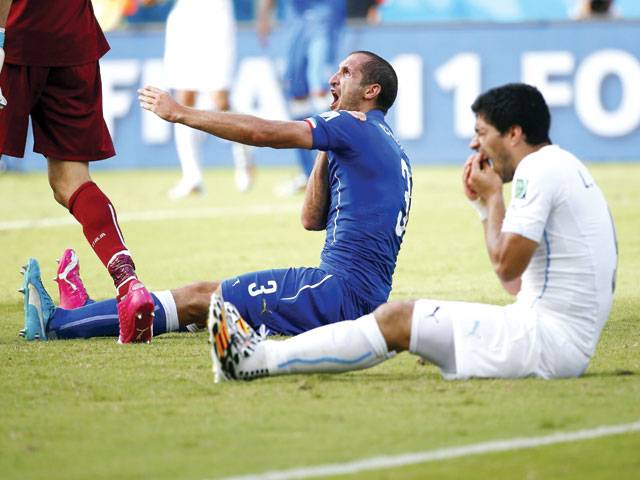 Italy out amid Suarez biting storm