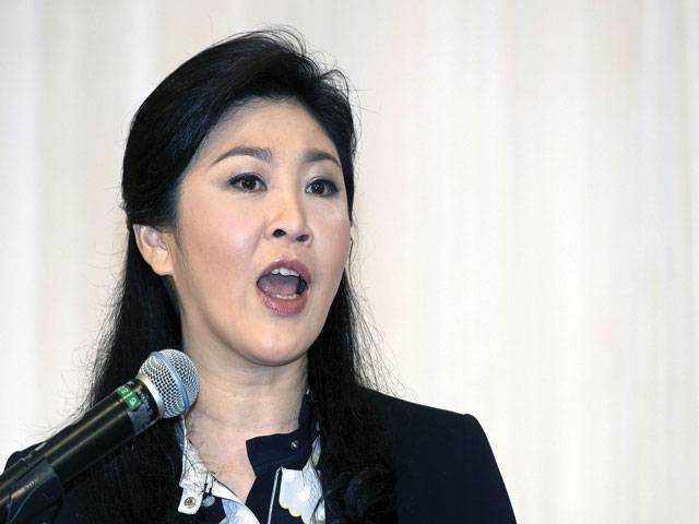 Ousted Thai PM Yingluck vows not to flee