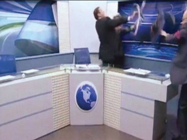 Journalist throws chair, water bottle at rival during TV show 
