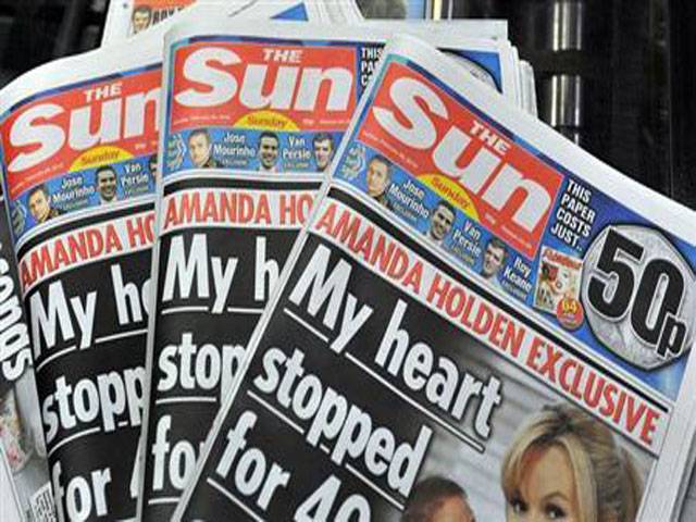 Sun reporter charged in UK bribery investigation