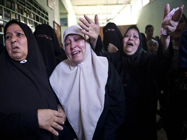 Palestinians mourn the death of their family an Israeli airstrike in Jabalia 