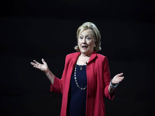 Hillary Clinton delivers a speech during a conference 