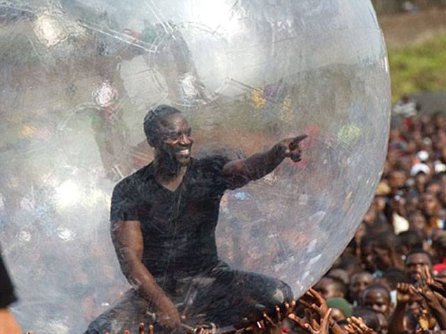 R&B star Akon tries to avoid catching Ebola in ball