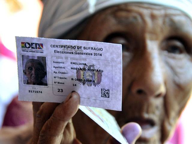 Bolivians casts her vote at a polling station