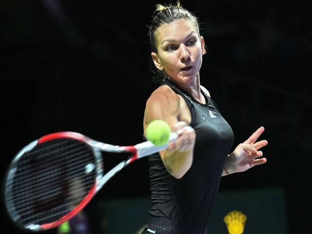 Halep splits with coach Fissette
