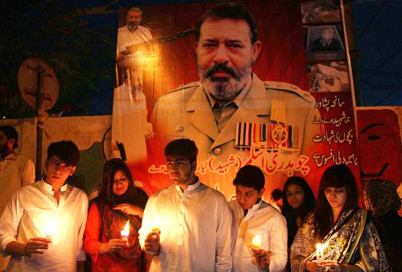 A candle light vigil holds to present tribute to of martyred CID officer Ch Aslam in Karachi