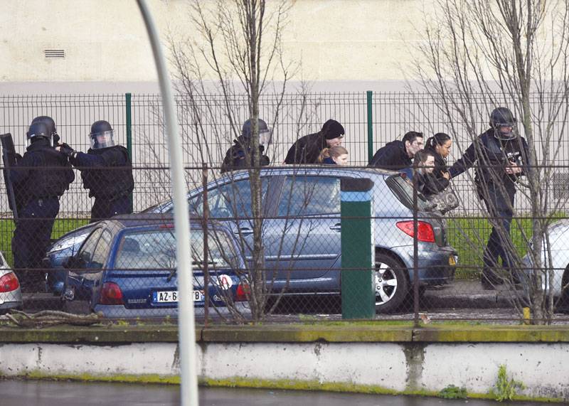 Charlie Hebdo suspects killed as twin sieges rock France