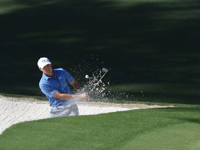 Spieth leads by four at drama-filled Masters