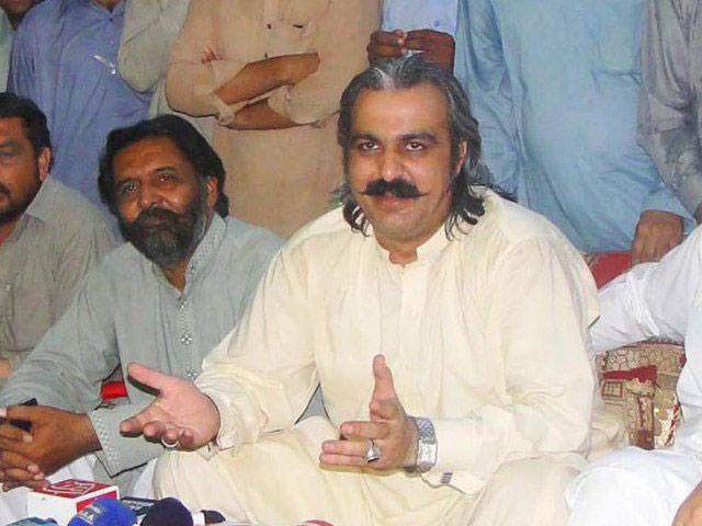 KP minister surrenders to police