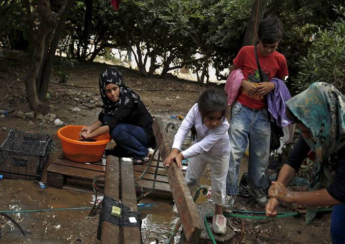 Migrants at a make-shift camp