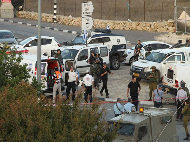 Israeli security forces gather at the site of car ramming attack West Bank City