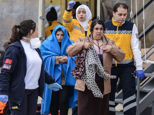 Rescued migrants arrive in Canakkale's in Turkey