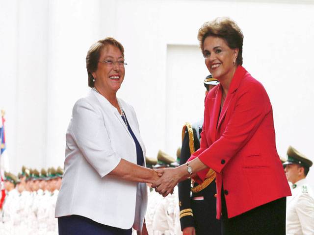 Brazil's President and Chile's President review honour guards in Santiago