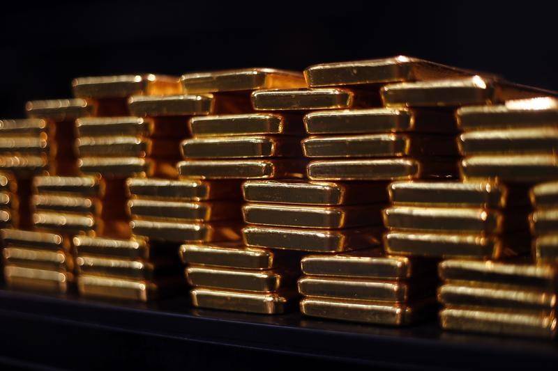 Spot gold hits 4-week low on dollar, US rate hike comments