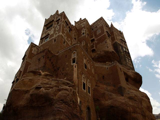 Yemenis visit the Dar al-Hajar (Rock Palace) in Sanaa