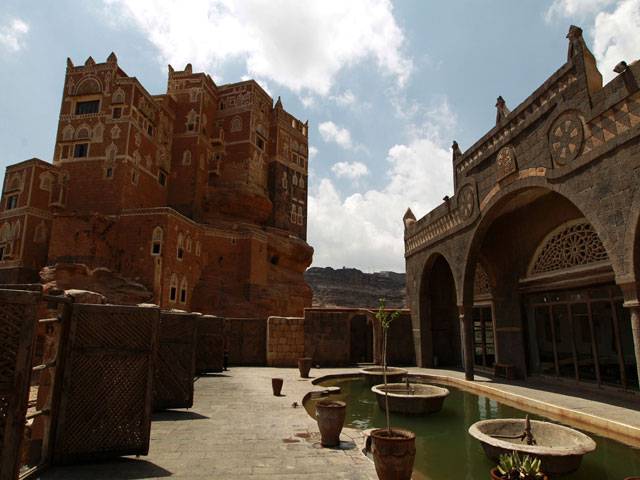 Yemenis visit the Dar al-Hajar (Rock Palace) in Sanaa