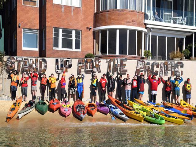 Climate protesters kayak to Australian PM’s home