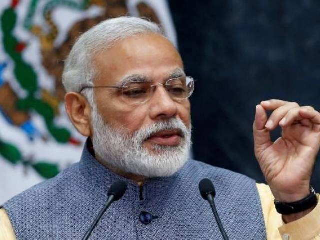 'Minimum govt' Modi swells ranks with new ministers