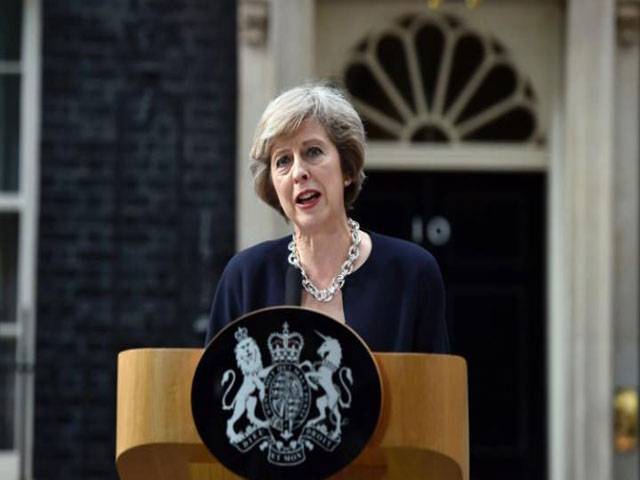 British PM May trades 10 Downing St for flat next door