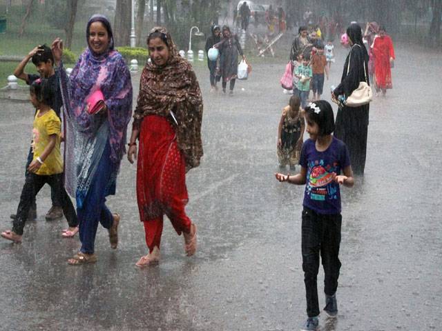 Families enjoying rain