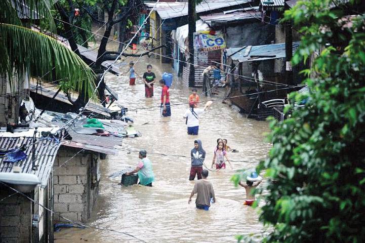 Five dead, tens of thousands flee Philippine floods