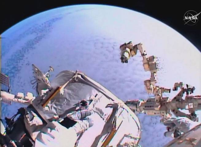 US astronauts begin spacewalk to install new docking port 