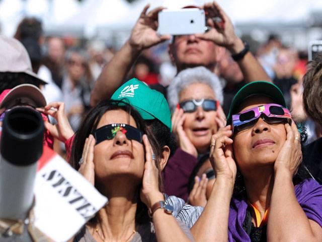 People look through eclipse1