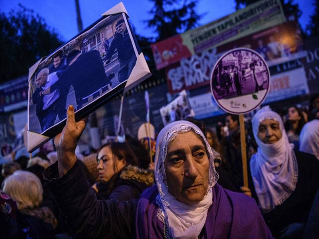Women shout slogans in Istanbul during a demonstration arrests the two co-mayors