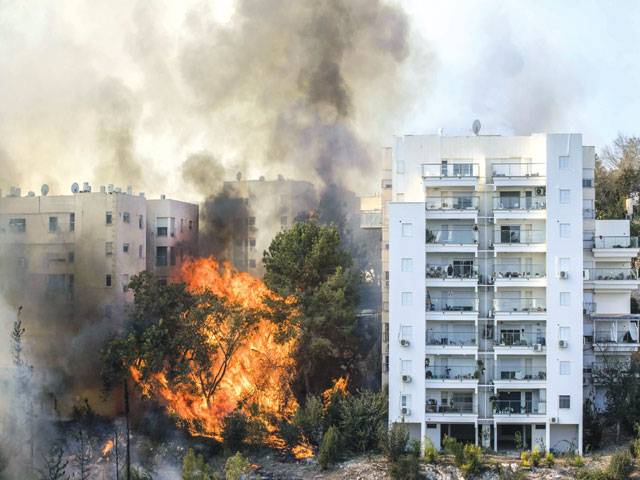Thousands evacuated as wildfires tear across Israel