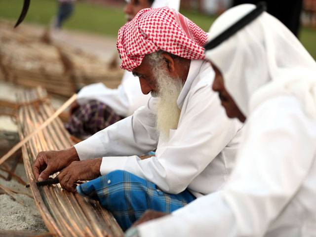 Emirati men plays during the 2016 Sheikh Zayed Heritage Festival