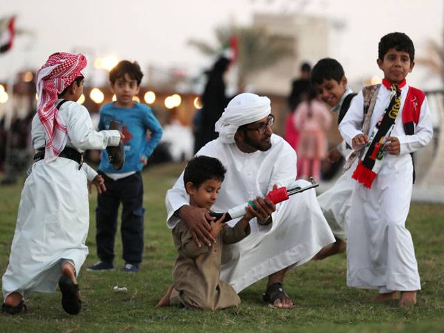 Emirati men plays during the 2016 Sheikh Zayed Heritage Festival