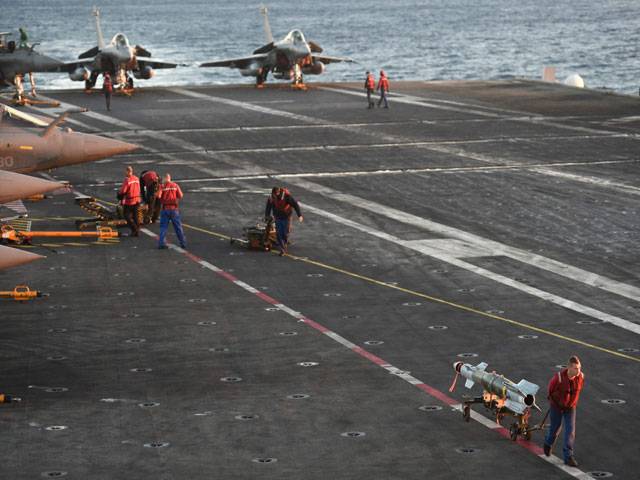  Hawkeye and Rafale fighter jets aboard France's aircraft carrier Charles-de-Gaulle