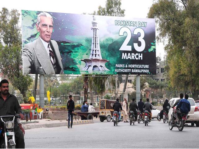  Natioinal flag on his road side on the eve of Pakistan Day