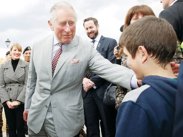 Prince Charles embraces Italy quake survivors