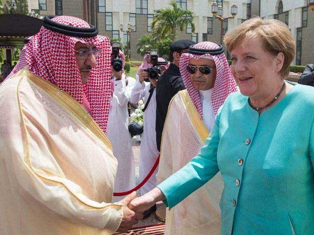 Angela Merkel chatting with King Salman during a welcoming ceremony in Jeddah