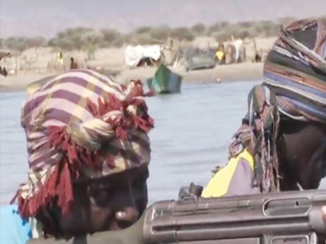 Fishing with guns on a lake under threat in Kenya