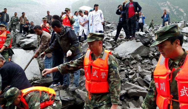 Hopes dim in search for 93 missing in China landslide