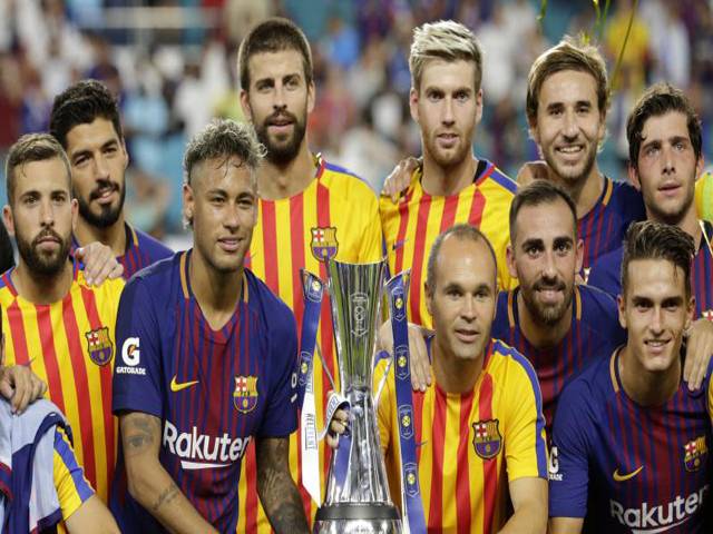 Pique lifts Barcelona as El Clasico lives up to hype