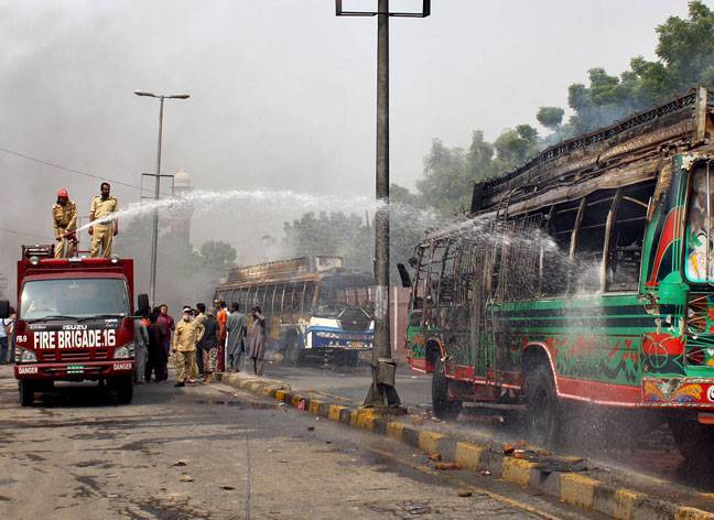 Firefighters struggling to extinguish fire on bus in Faisalabad