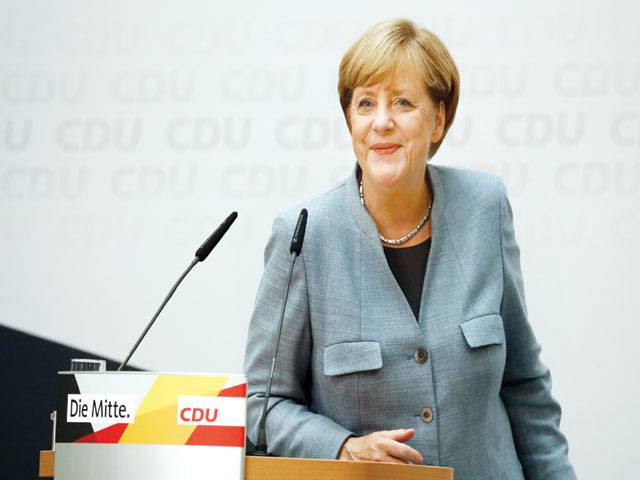 Humbled Merkel vows to win back hard-right voters