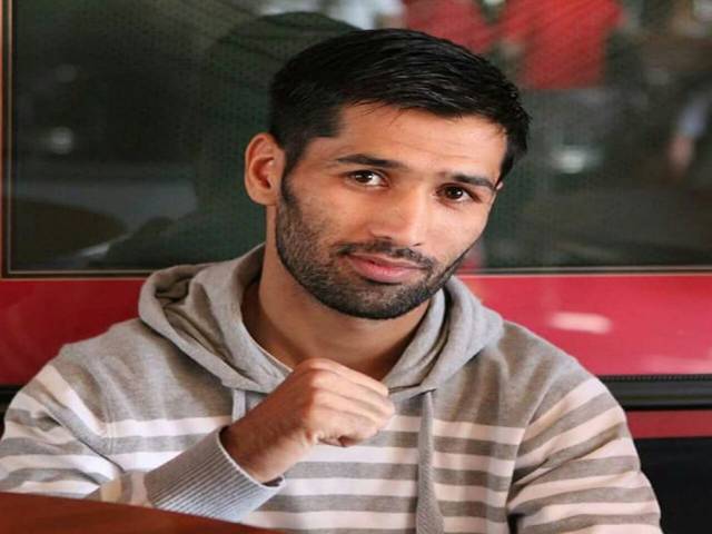 Boxer Waseem downs Carlos to record eighth consecutive win